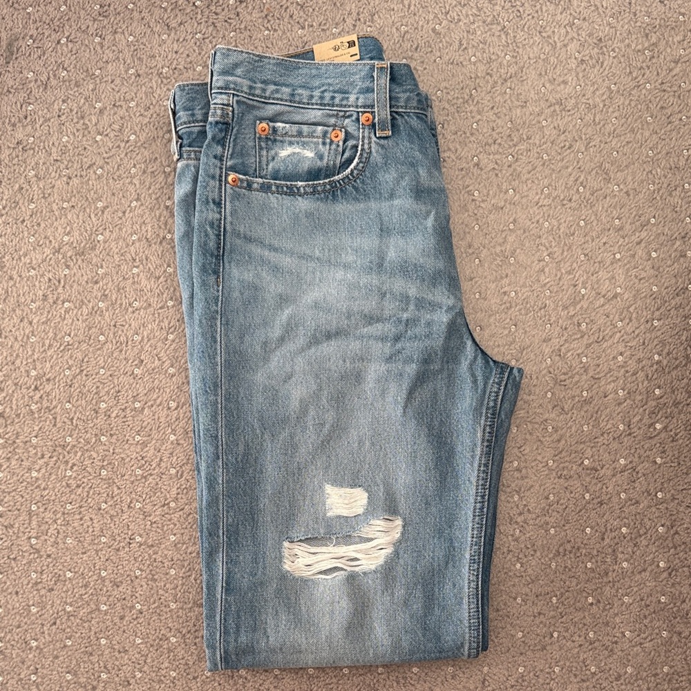 Levi's Blue Straight Leg Jeans with Vintage-Inspired Distressing